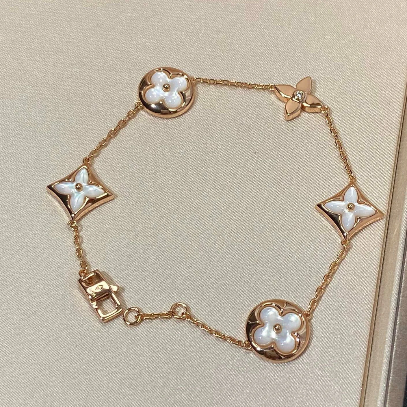 [Loui]STAR AND SUN 5 MOTIF MOP PINK GOLD BRACELET