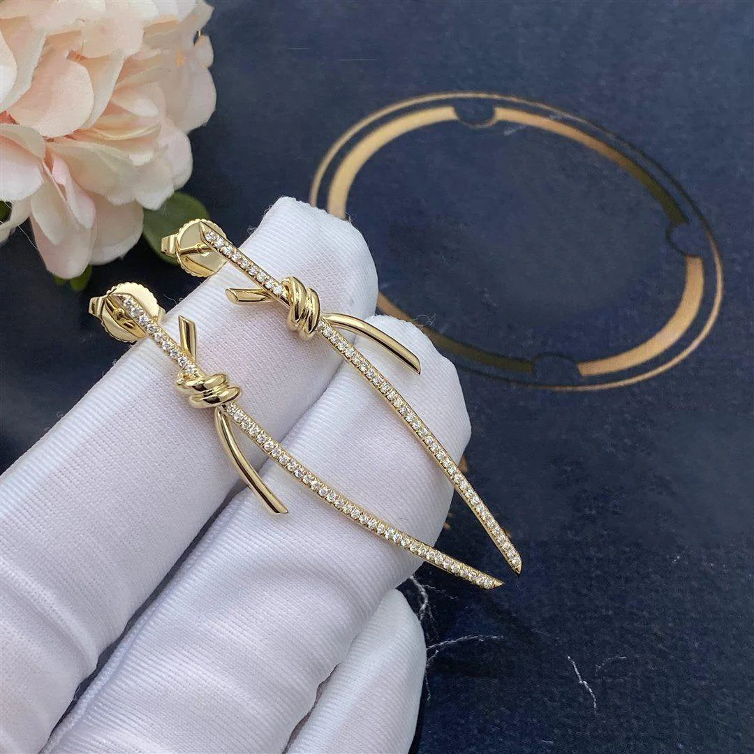 [TF]KNOT DROP EARRINGS IN GOLD WITH DIAMONDS